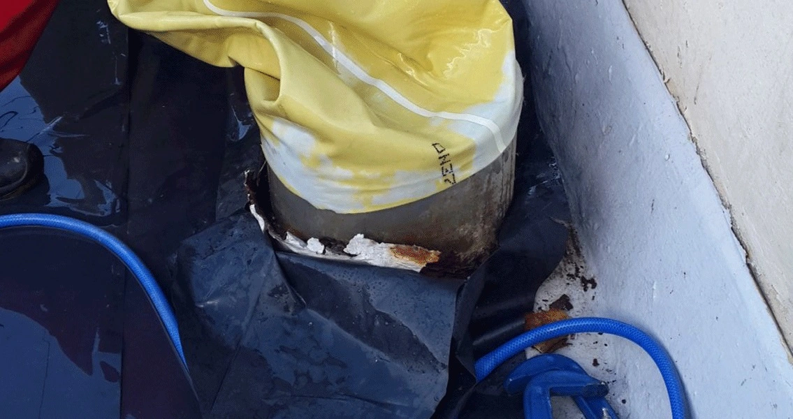 The access to the waste chute on the roof of the apartment block (left). Once it had been impregnated, the liner was inverted for installation.